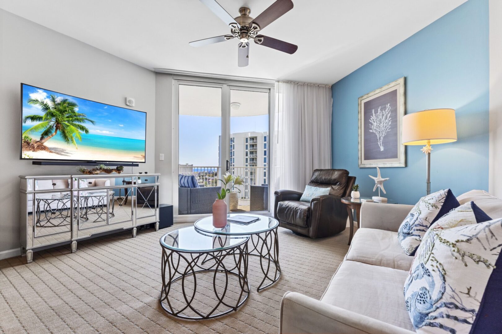 A living room with a couch, chair and television.