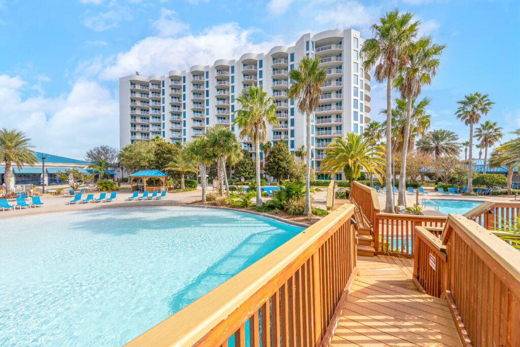 A boardwalk leading to the pool at an apartment complex.