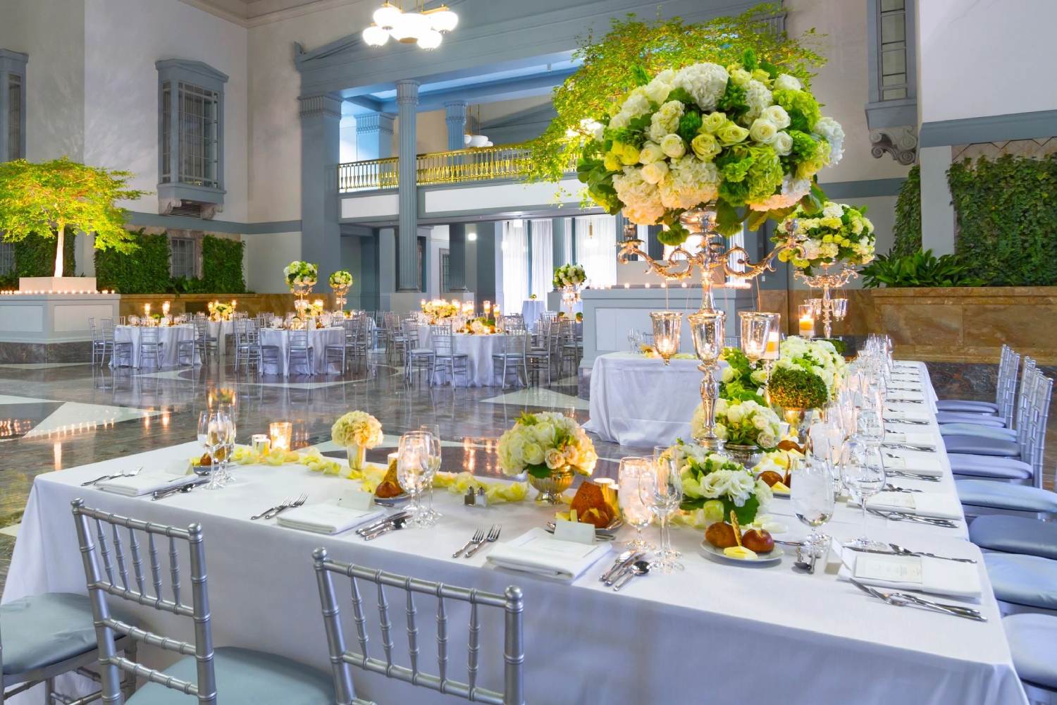 A table set up with flowers and candles.